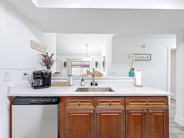 1309 SW 75th Ave, North Lauderdale, FL 33068 - kitchen with stainless steel dishwasher, light countertops, and brown cabinetry