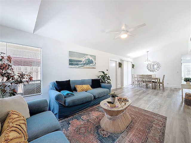 1309 SW 75th Ave, North Lauderdale, FL 33068 - living area featuring lofted ceiling, ceiling fan, light wood-style flooring, and a chandelier