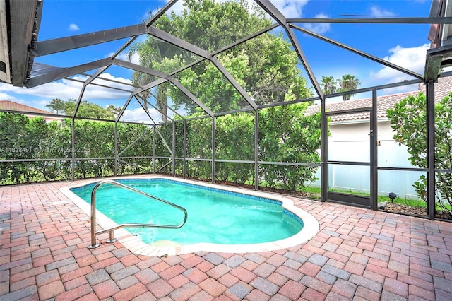 swimming pool with a patio and a lanai