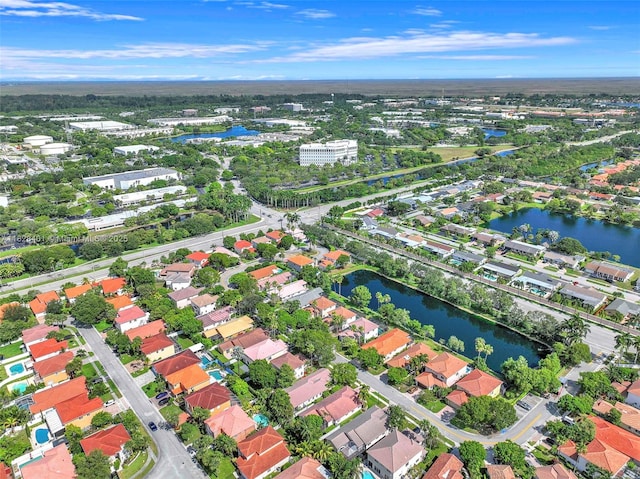 view of property location with a large body of water and nearby suburban area