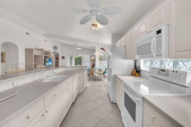 kitchen with white appliances, ceiling fan, white cabinetry, light tile patterned flooring, and light countertops