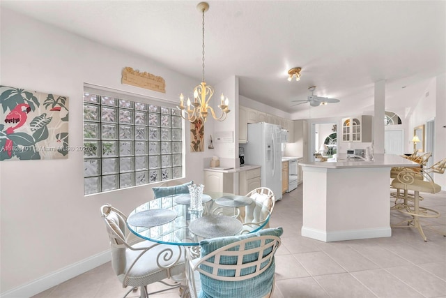 dining room featuring light tile patterned flooring, a chandelier, and ceiling fan