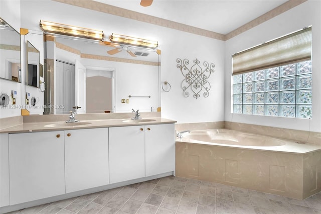 full bathroom with ceiling fan, double vanity, and a garden tub