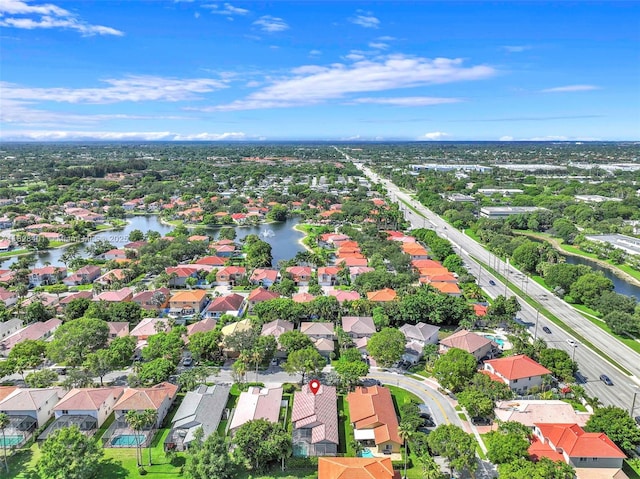 aerial perspective of suburban area featuring a large body of water