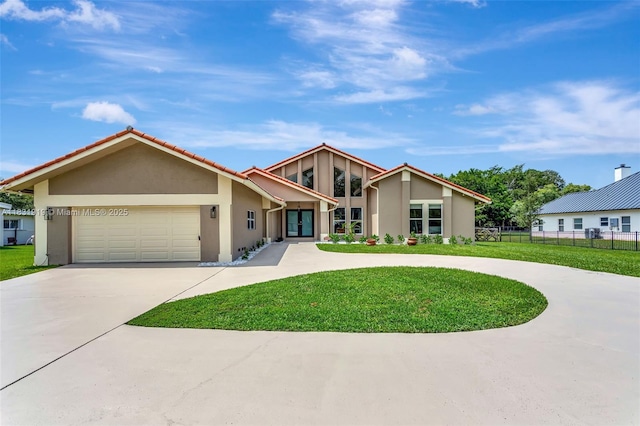 14100 SW 21st St, Davie, FL 33325 - mid-century inspired home featuring curved driveway, stucco siding, and a garage