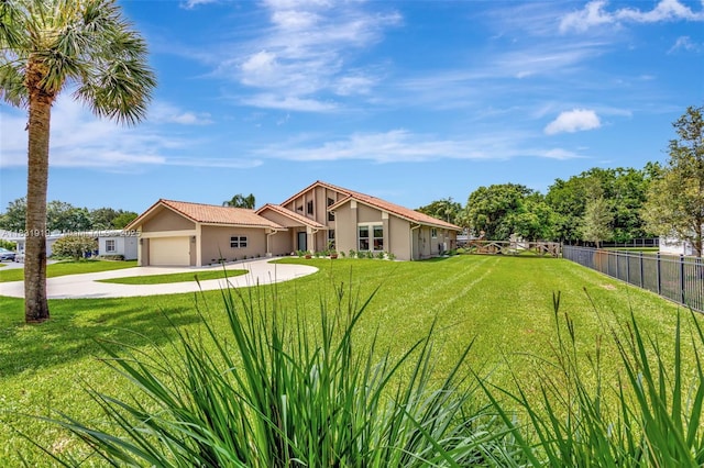 14100 SW 21st St, Davie, FL 33325 - view of front of home with driveway, an attached garage, and stucco siding