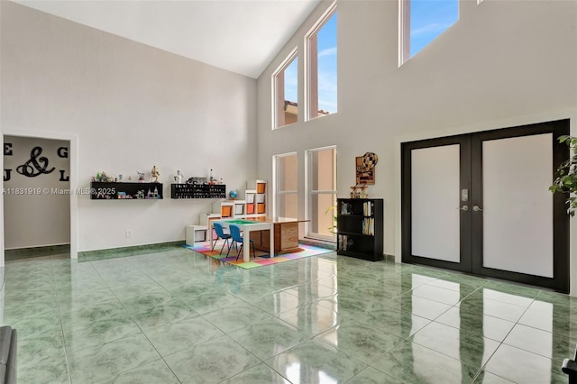 14100 SW 21st St, Davie, FL 33325 - tiled entrance foyer featuring a towering ceiling and french doors