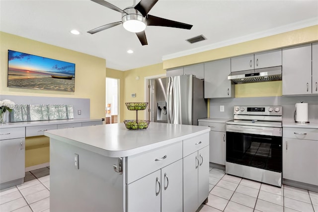 14100 SW 21st St, Davie, FL 33325 - kitchen with stainless steel appliances, under cabinet range hood, light countertops, a ceiling fan, and light tile patterned flooring