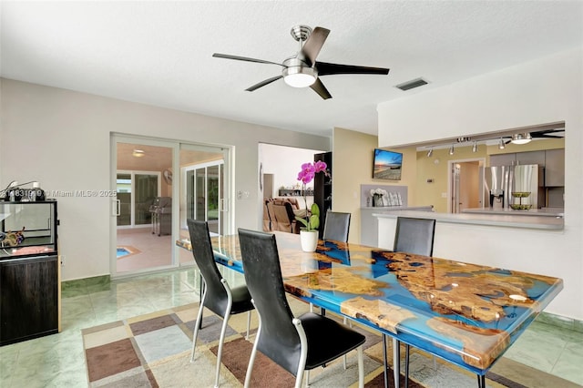 14100 SW 21st St, Davie, FL 33325 - dining room featuring a ceiling fan and rail lighting