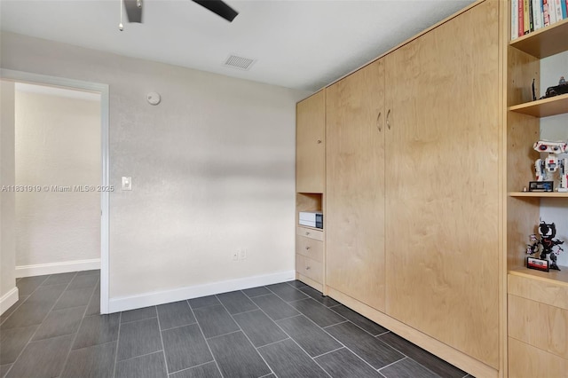 14100 SW 21st St, Davie, FL 33325 - unfurnished bedroom featuring baseboards and ceiling fan