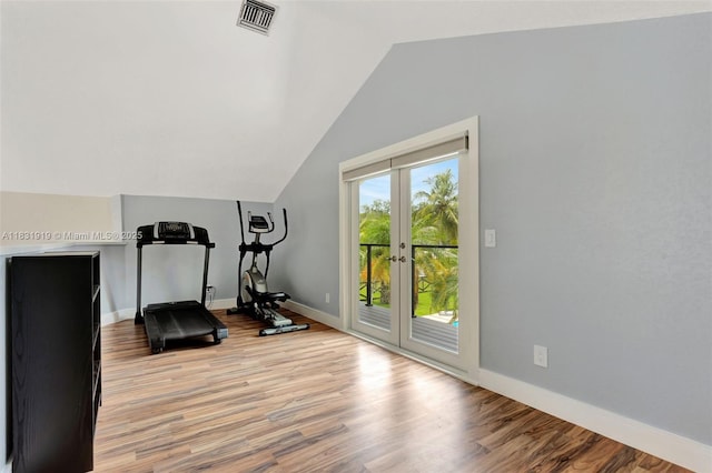 14100 SW 21st St, Davie, FL 33325 - workout room featuring vaulted ceiling, light wood-style floors, and french doors
