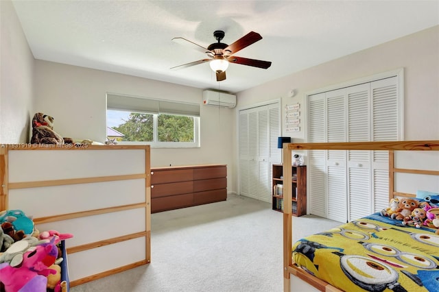 14100 SW 21st St, Davie, FL 33325 - bedroom with two closets, a wall mounted AC, light carpet, and a ceiling fan