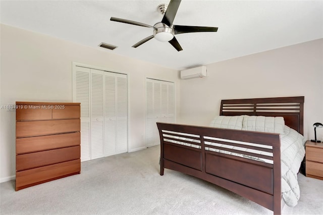14100 SW 21st St, Davie, FL 33325 - carpeted bedroom with a wall unit AC, multiple closets, and ceiling fan