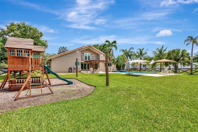 14100 SW 21st St, Davie, FL 33325 - view of playground featuring a pool, a yard, and a patio area