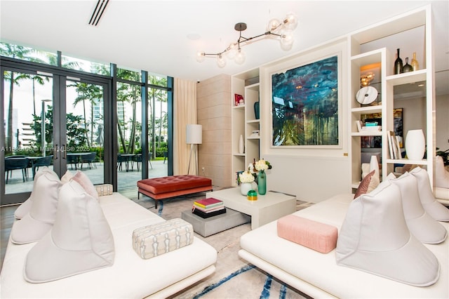 650 NE 32nd St Unit 2205, Miami, FL 33137 - living room with a chandelier, french doors, and floor to ceiling windows