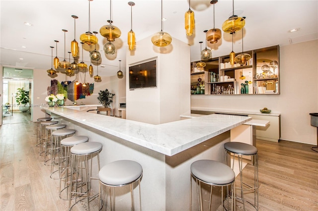 650 NE 32nd St Unit 2205, Miami, FL 33137 - bar featuring light wood-style flooring and decorative light fixtures