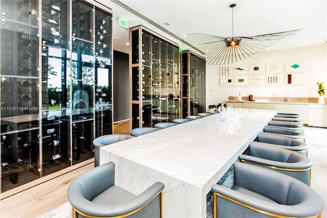 650 NE 32nd St Unit 2205, Miami, FL 33137 - wine room featuring a sink and wood finished floors