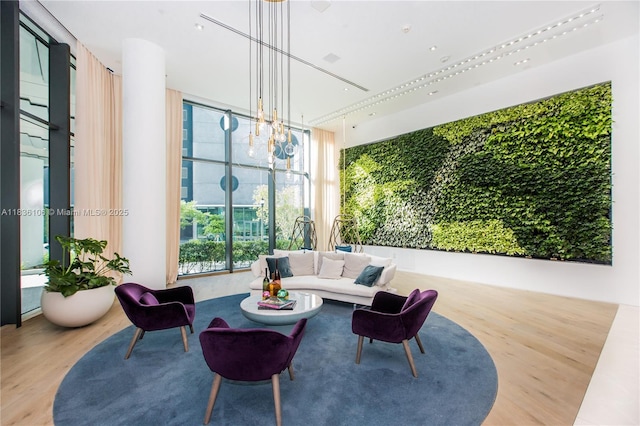 650 NE 32nd St Unit 2205, Miami, FL 33137 - living room with wood finished floors, floor to ceiling windows, and a chandelier