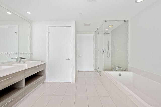 650 NE 32nd St Unit 2205, Miami, FL 33137 - full bathroom with double vanity, a shower stall, a garden tub, tile patterned flooring, and recessed lighting