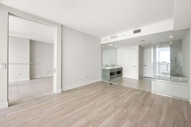 650 NE 32nd St Unit 2205, Miami, FL 33137 - unfurnished living room with light wood-style flooring