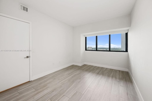 650 NE 32nd St Unit 2205, Miami, FL 33137 - empty room featuring light wood-type flooring and baseboards