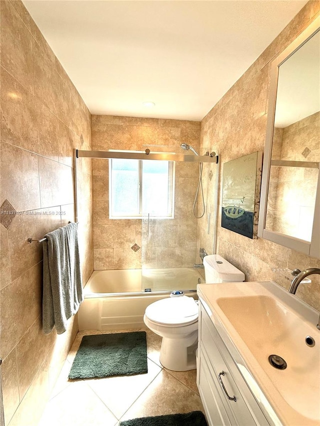 117 Almar Dr, Wilton Manors, FL 33334 - bathroom with tile walls, combined bath / shower with glass door, vanity, and tile patterned floors