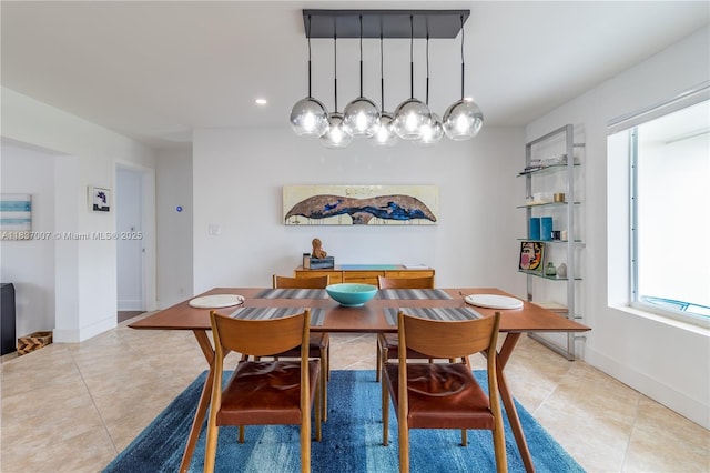 117 Almar Dr, Wilton Manors, FL 33334 - dining space featuring light tile patterned floors and baseboards