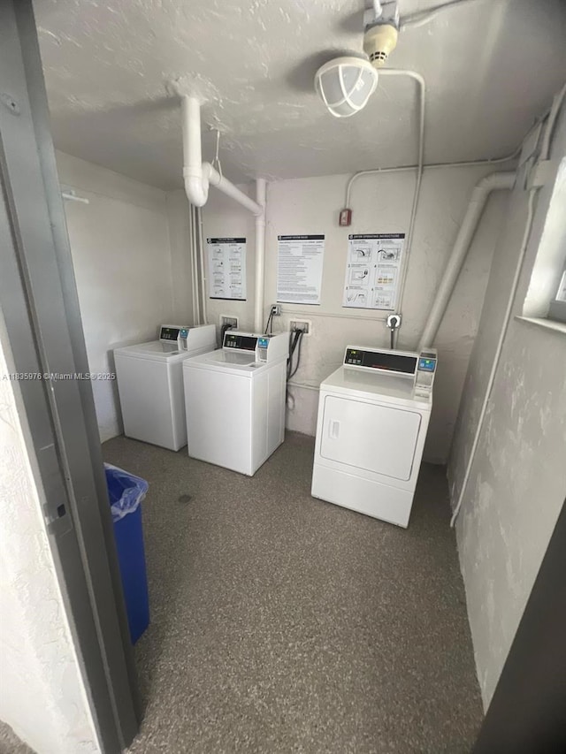 14180 SW 84th St Unit 407-G, Miami, FL 33183 - community laundry with washing machine and dryer and a textured ceiling