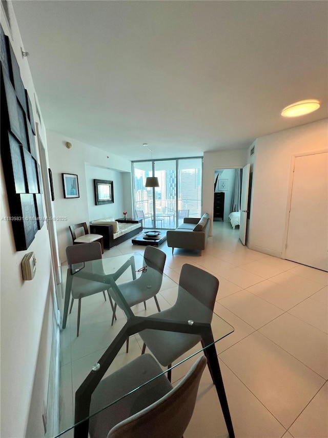 350 S Miami Ave Unit 2303, Miami, FL 33130 - dining room featuring light tile patterned floors and expansive windows