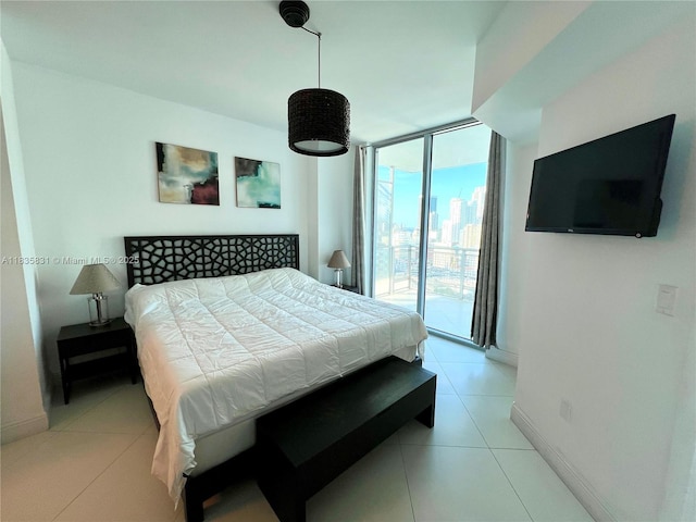 350 S Miami Ave Unit 2303, Miami, FL 33130 - bedroom with a wall of windows, access to outside, and light tile patterned flooring