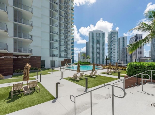 350 S Miami Ave Unit 2303, Miami, FL 33130 - view of home's community featuring a skyline view, a pool, and a lawn