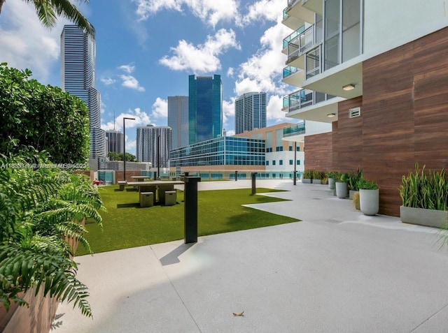 350 S Miami Ave Unit 2303, Miami, FL 33130 - view of home's community with a skyline view, a swimming pool, and a yard
