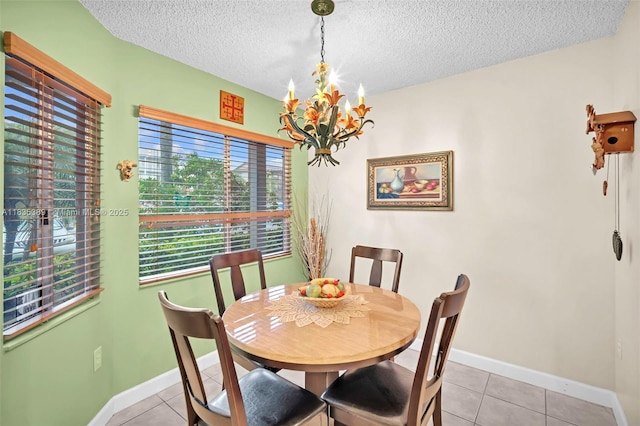 801 SW 138th Ave Unit 103E, Pembroke Pines, FL 33027 - dining area with a chandelier, light tile patterned flooring, and a textured ceiling
