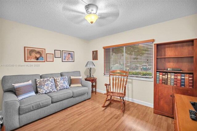 801 SW 138th Ave Unit 103E, Pembroke Pines, FL 33027 - living room featuring light wood-type flooring, a textured ceiling, and ceiling fan