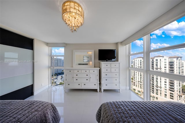 100 Bayview Dr Unit 1905, Sunny Isles Beach, FL 33160 - bedroom with a chandelier and baseboards