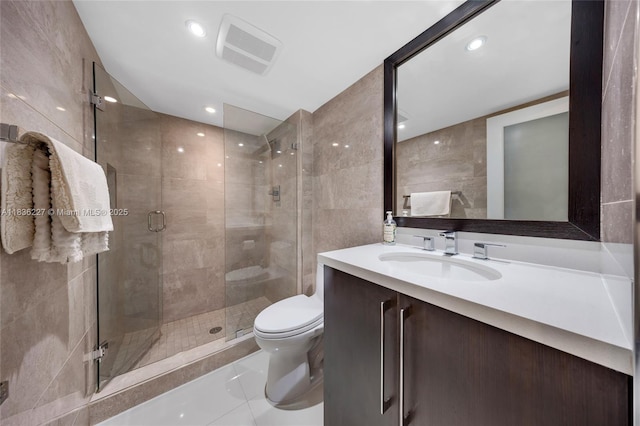 100 Bayview Dr Unit 1905, Sunny Isles Beach, FL 33160 - full bath featuring vanity, a shower stall, tile walls, and tile patterned flooring
