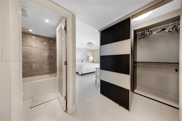 100 Bayview Dr Unit 1905, Sunny Isles Beach, FL 33160 - bathroom featuring ensuite bathroom, tile patterned flooring, washtub / shower combination, recessed lighting, and a closet