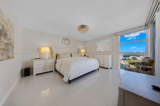 100 Bayview Dr Unit 1905, Sunny Isles Beach, FL 33160 - tiled bedroom featuring baseboards