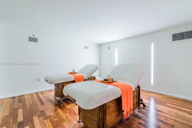 1040 Biscayne Blvd Unit 2402, Miami, FL 33132 - dining space with hardwood / wood-style floors and baseboards