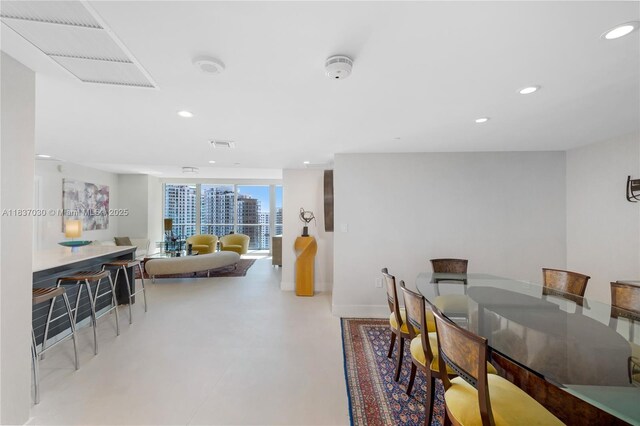 200 Biscayne Boulevard Way Unit 3207, Miami, FL 33131 - dining space with recessed lighting and concrete flooring