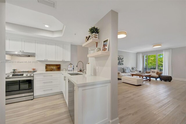 7588 SW 102nd St Unit 203, Pinecrest, FL 33156 - living area featuring wood finished floors and ornamental molding
