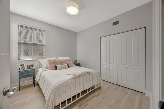 7588 SW 102nd St Unit 203, Pinecrest, FL 33156 - bedroom with light wood-type flooring and a closet