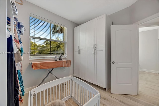 7588 SW 102nd St Unit 203, Pinecrest, FL 33156 - bedroom with light wood-style floors and baseboards