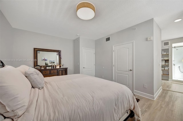 7588 SW 102nd St Unit 203, Pinecrest, FL 33156 - bedroom featuring light wood-style floors and baseboards