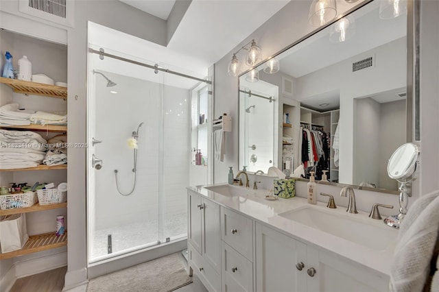 7588 SW 102nd St Unit 203, Pinecrest, FL 33156 - full bath featuring a walk in closet, double vanity, and a shower stall