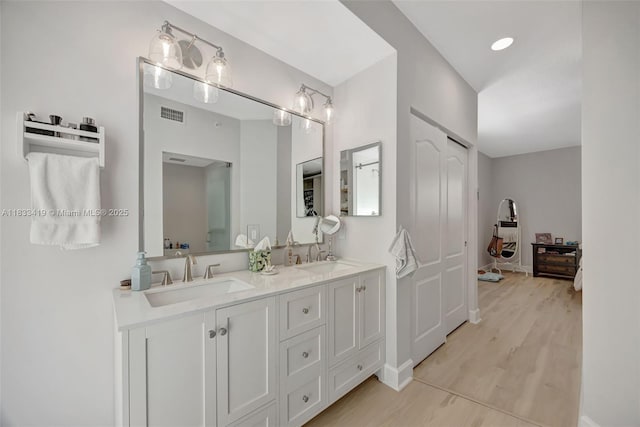7588 SW 102nd St Unit 203, Pinecrest, FL 33156 - full bath with double vanity and wood finished floors