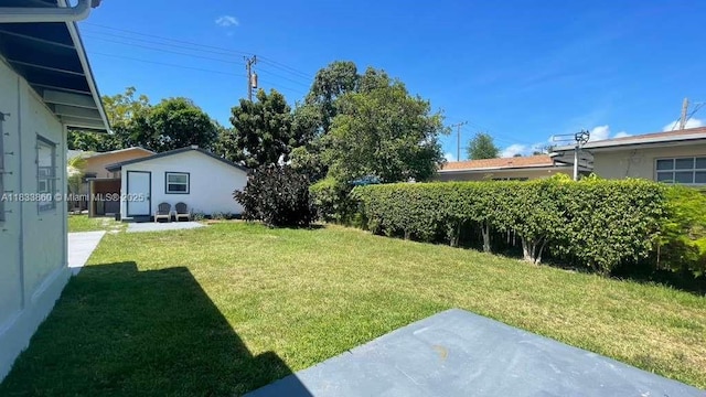 2993 SW 16th Ter, Miami, FL 33145 - view of grassy yard featuring a patio