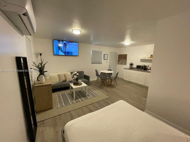 2993 SW 16th Ter, Miami, FL 33145 - bedroom with a wall mounted air conditioner and wood finished floors