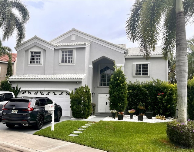 547 Cascade Falls Dr, Weston, FL 33327 - view of front of home featuring an attached garage, stucco siding, a front lawn, and a tiled roof