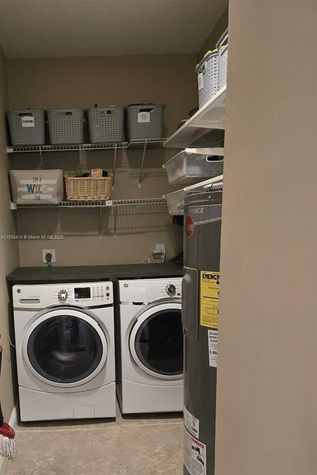 547 Cascade Falls Dr, Weston, FL 33327 - laundry room featuring washing machine and clothes dryer and electric water heater